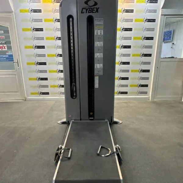 A person performing a cable chest press on the Cybex Bravo Lift in a modern Dubai home gym, highlighting the versatile cable system and full-body engagement. The image emphasizes the comprehensive workout capabilities for home users in the UAE.