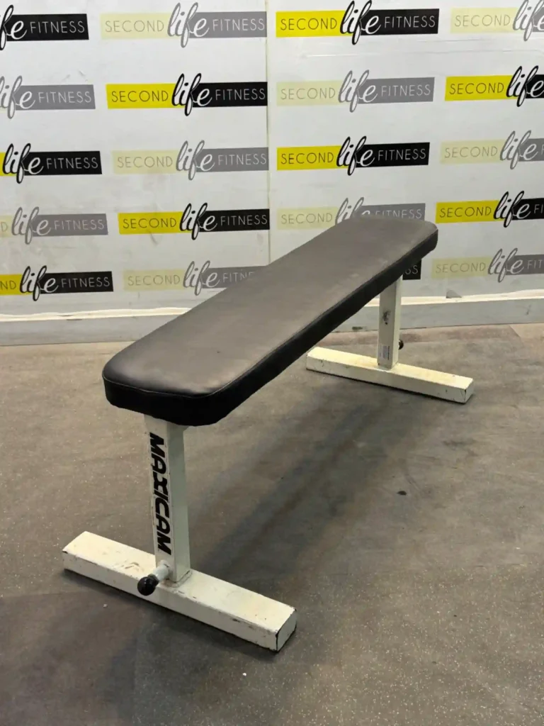 High-angle shot of the Ultimate Flat Bench in a Dubai home gym, highlighting its 154 lbs powder-coated steel frame, non-slip foot caps on marble flooring, and premium high-density foam pad—ideal for chest and core strength training in the UAE.