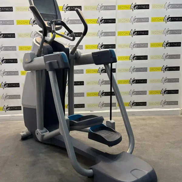 A person comfortably using the Precor Open Stride elliptical in a modern Dubai home gym, highlighting the natural, adaptable stride and the integrated entertainment console displaying a TV show. The image emphasizes the user-friendly experience and the seamless integration of fitness and entertainment in a UAE home setting.